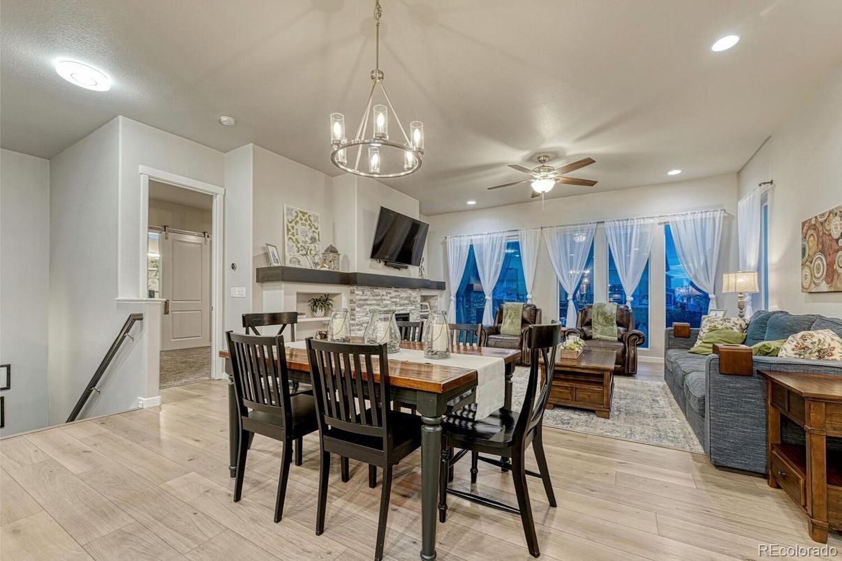 Dining room, Fireplace, Interior, Living room, Pendant Lights, Recessed Lighting, Wood Texture Flooring