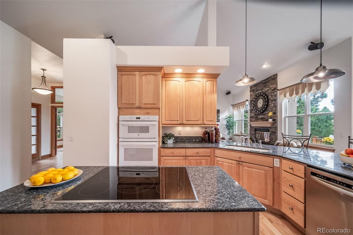 Fireplace, Interior, Kitchen, Pendant Lights, Recessed Lighting, Stainless Steel Appliances, Wood Texture Flooring