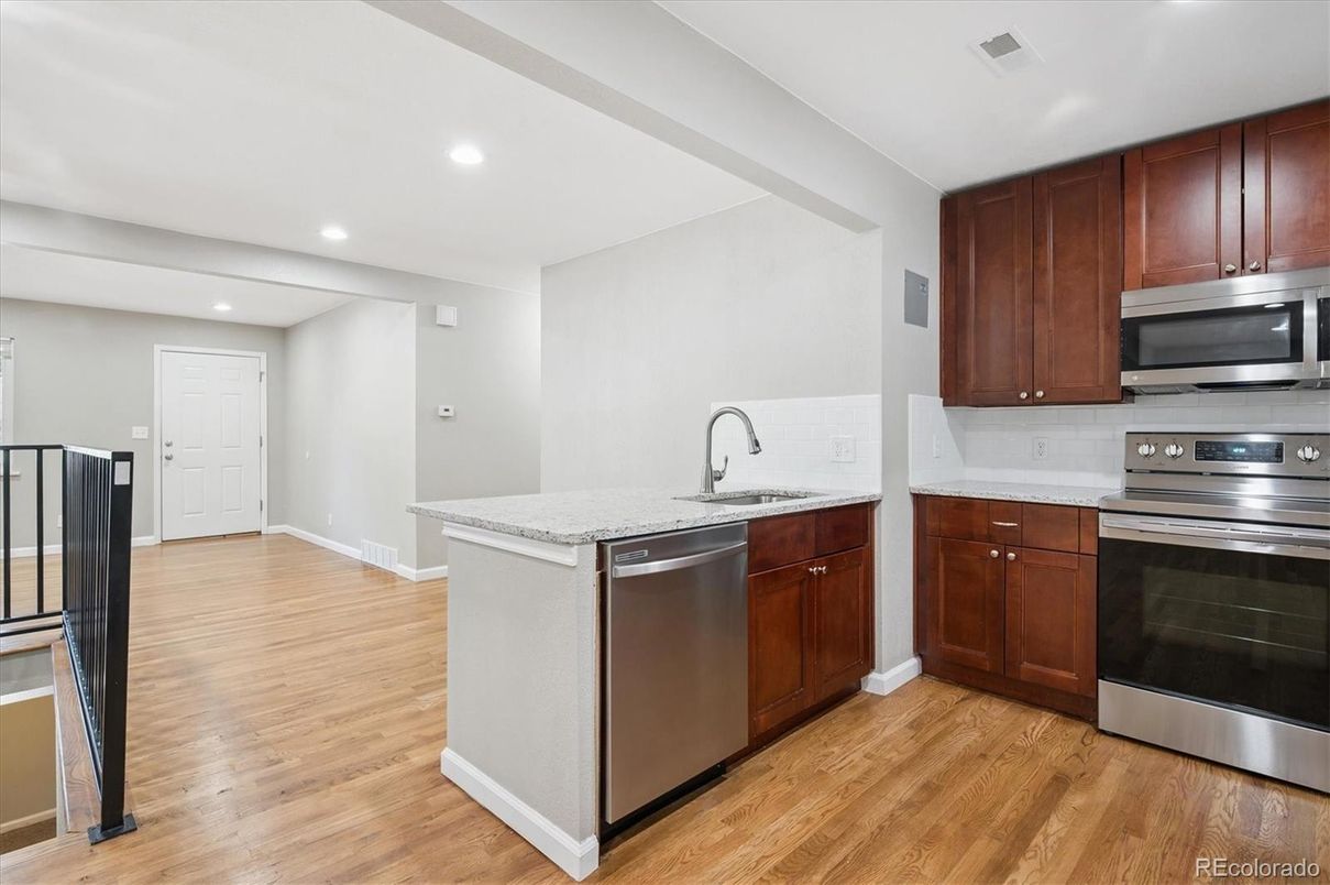 Interior, Kitchen, Recessed Lighting, Stainless Steel Appliances, Wood Texture Flooring