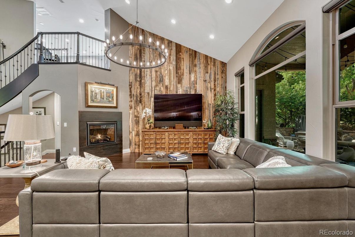 Chandelier, Fireplace, Interior, Living room, Pendant Lights, Recessed Lighting, Wood Texture Flooring, Wooden Walls