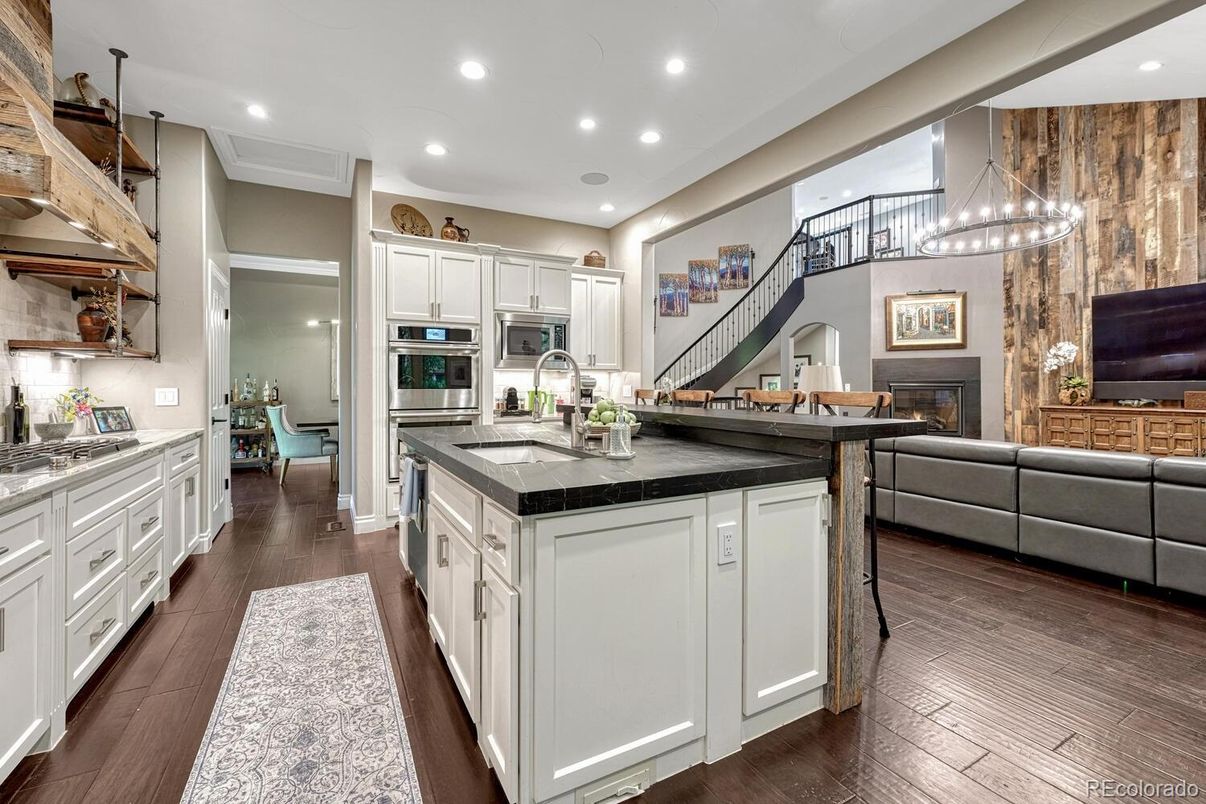Fireplace, Interior, Kitchen, Living room, Pendant Lights, Recessed Lighting, Stainless Steel Appliances, Wood Texture Flooring
