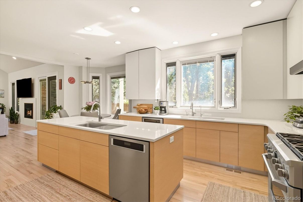 Dining room, Fireplace, Interior, Kitchen, Pendant Lights, Recessed Lighting, Stainless Steel Appliances, Wood Texture Flooring