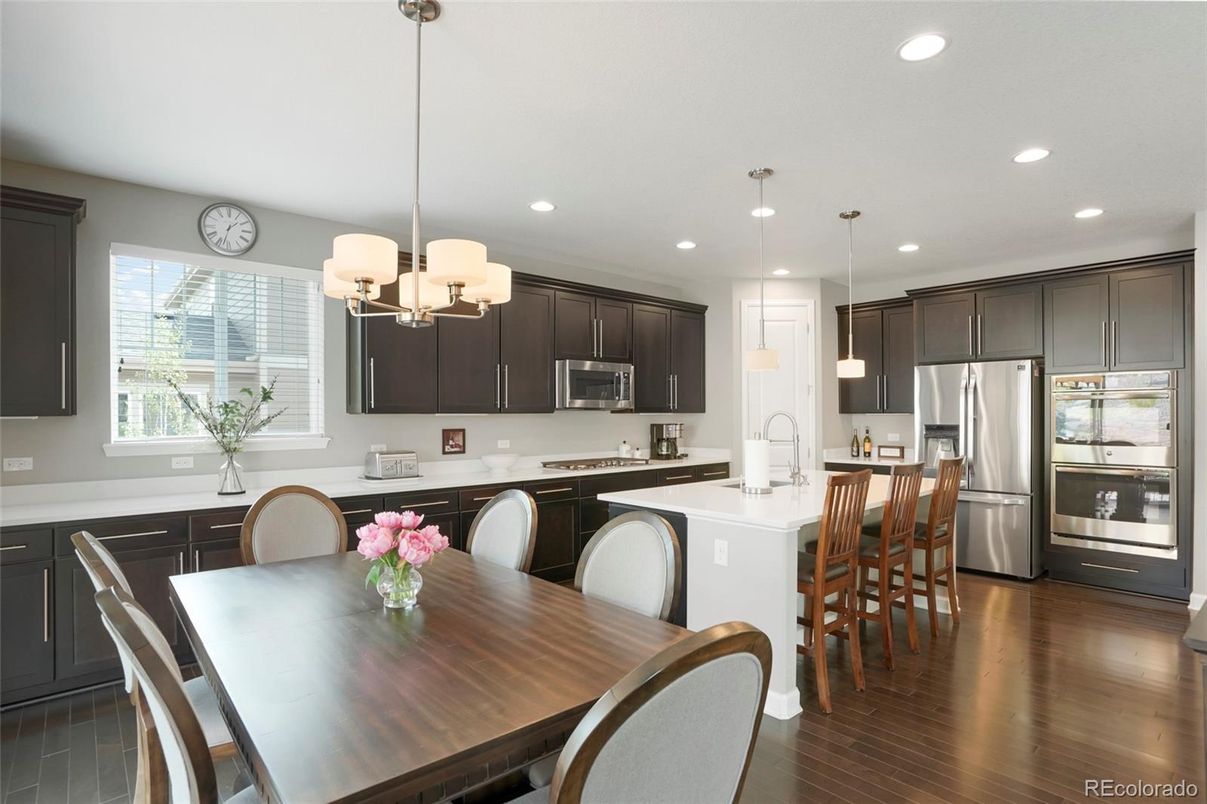 Chandelier, Dining room, Interior, Kitchen, Pendant Lights, Recessed Lighting, Stainless Steel Appliances, Wood Texture Flooring