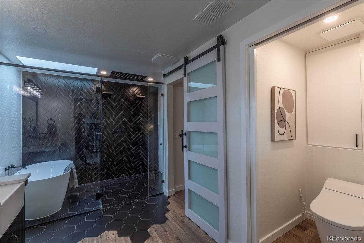 Bathroom, Free Standing Baths, Glass Shower, Interior, Recessed Lighting, Wood Texture Flooring