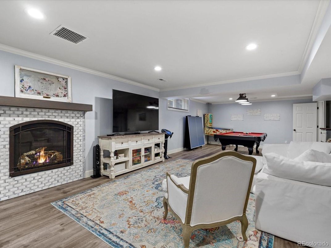 Billiard Table, Fireplace, Game Room, Interior, Living room, Pendant Lights, Recessed Lighting, Wood Texture Flooring