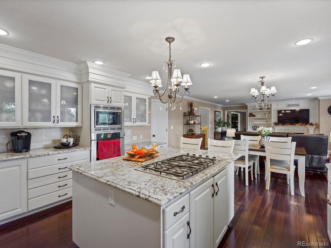 Chandelier, Dining room, Interior, Kitchen, Recessed Lighting, Stainless Steel Appliances, Wood Texture Flooring