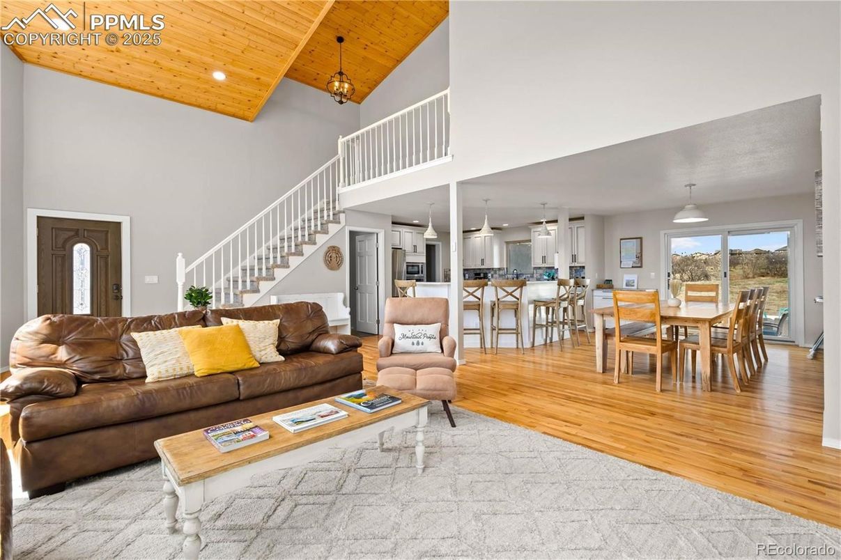 Dining room, Interior, Kitchen, Living room, Pendant Lights, Recessed Lighting, Stainless Steel Appliances, Wooden Ceilings, Wood Texture Flooring