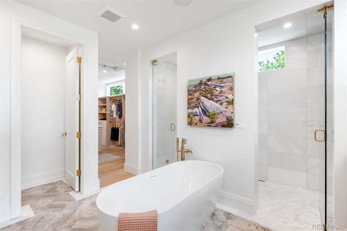 Bathroom, Free Standing Baths, Glass Shower, Interior, Marble Walls, Recessed Lighting, Wood Texture Flooring