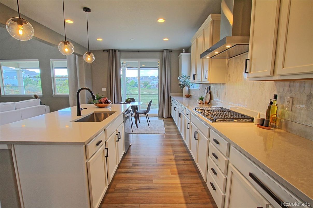Dining room, Interior, Kitchen, Pendant Lights, Recessed Lighting, Stainless Steel Appliances, Wood Texture Flooring