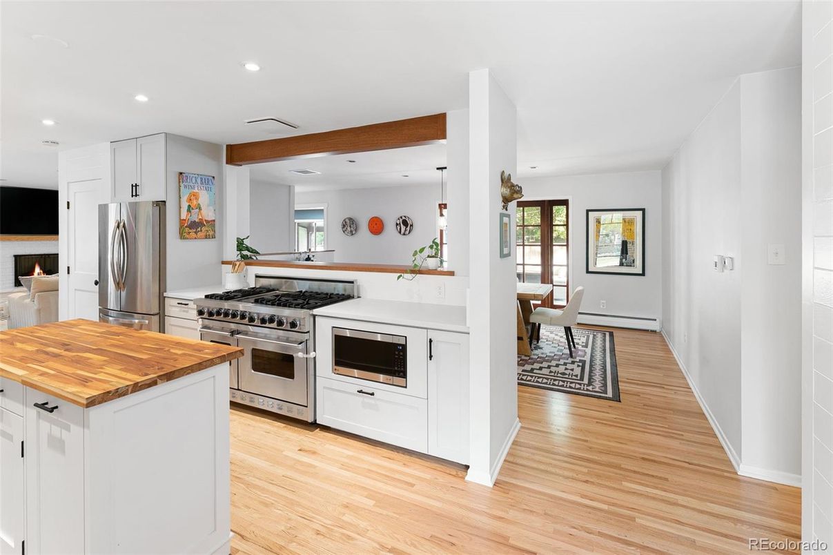 Dining room, Interior, Kitchen, Pendant Lights, Recessed Lighting, Stainless Steel Appliances, Wooden Beams, Wood Texture Flooring