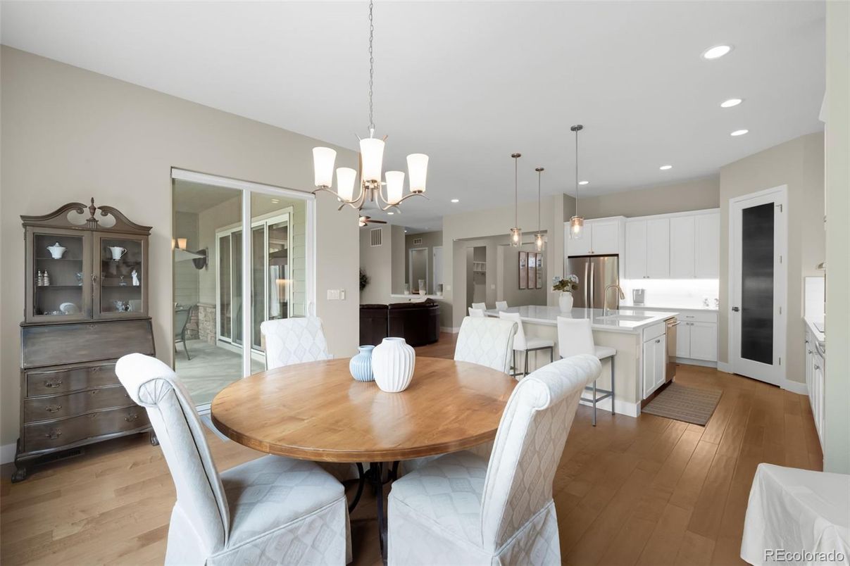 Chandelier, Dining room, Interior, Kitchen, Pendant Lights, Recessed Lighting, Stainless Steel Appliances, Wood Texture Flooring