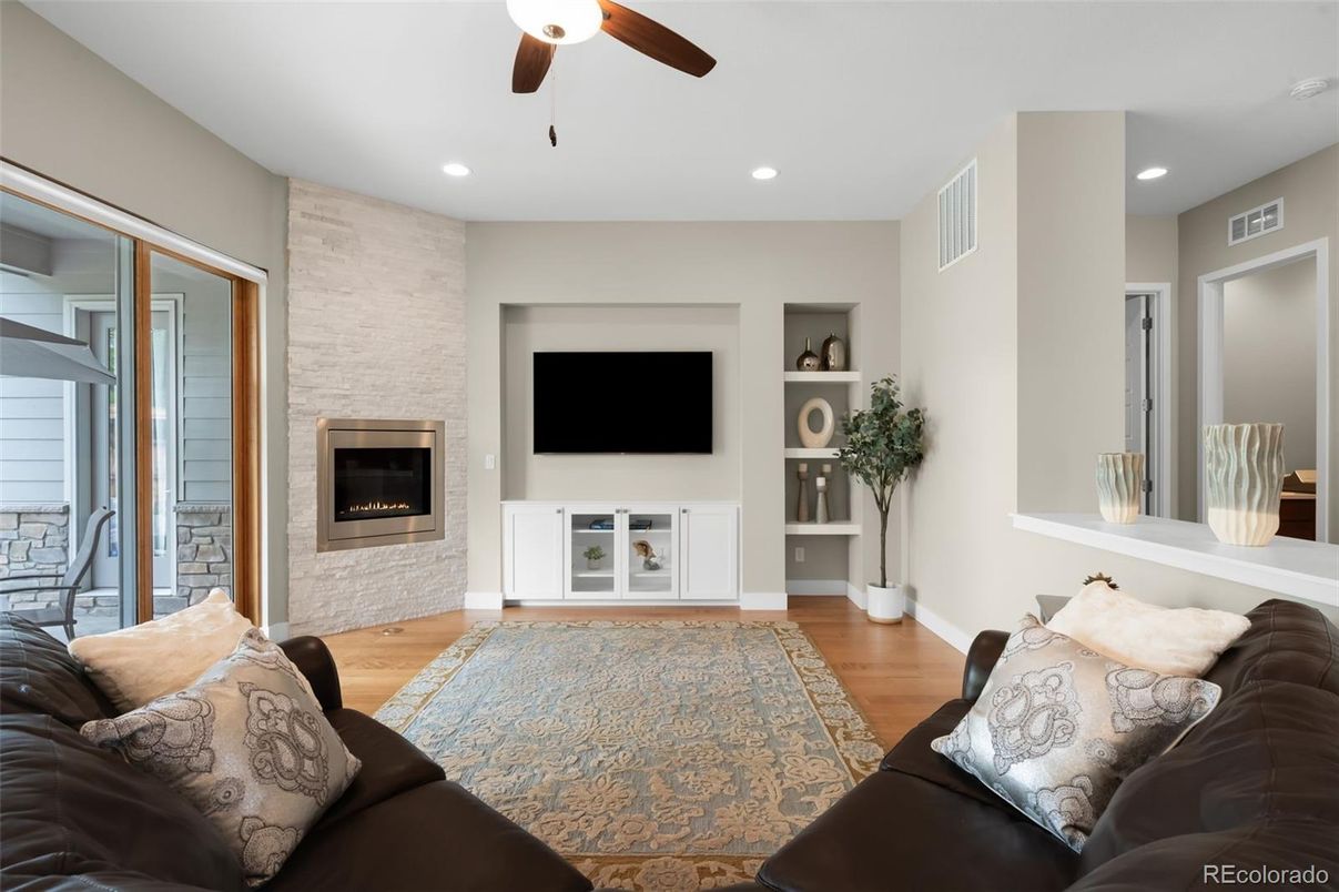 Fireplace, Interior, Living room, Recessed Lighting, Stone Walls, Wood Texture Flooring