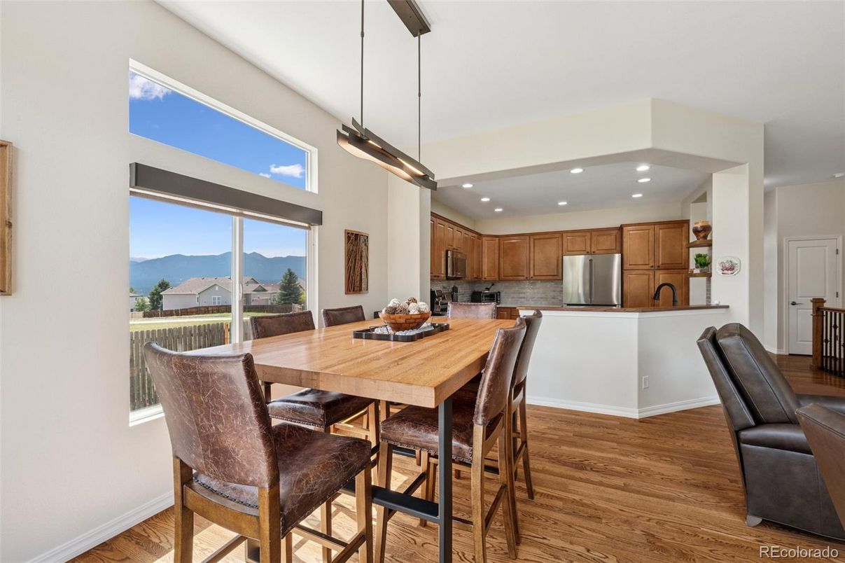Dining room, Interior, Kitchen, Pendant Lights, Recessed Lighting, Stainless Steel Appliances, Wood Texture Flooring