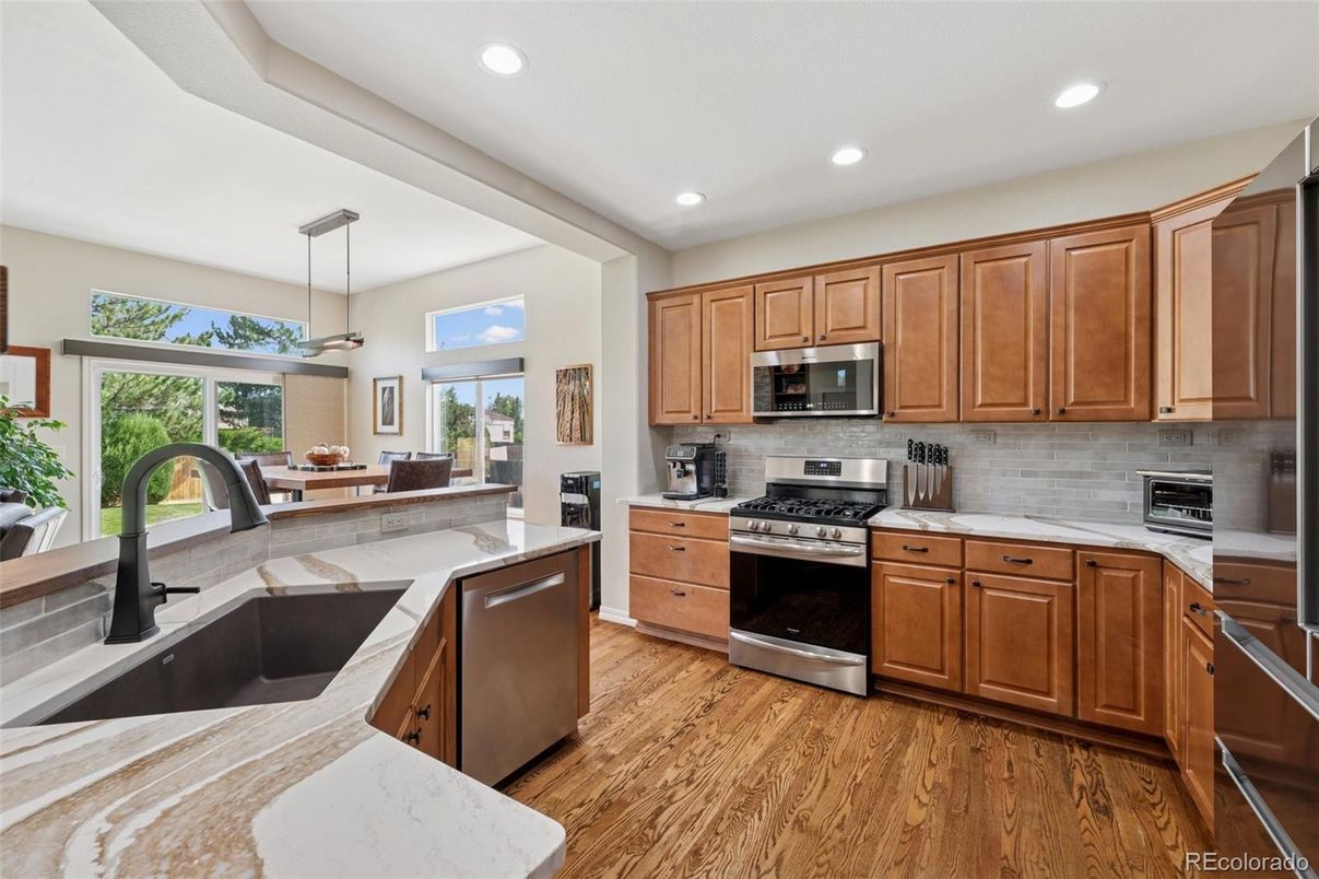 Interior, Kitchen, Pendant Lights, Recessed Lighting, Stainless Steel Appliances, Wood Texture Flooring