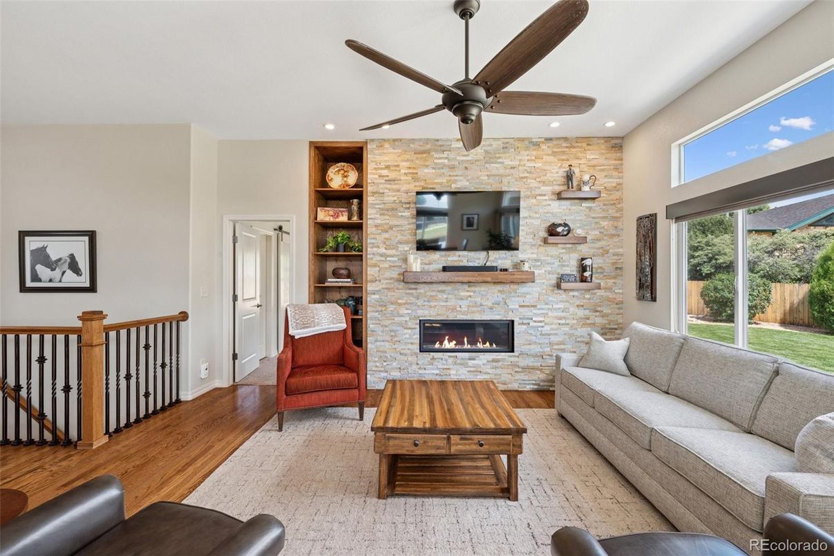 Fireplace, Interior, Living room, Recessed Lighting, Stone Walls, Wood Texture Flooring