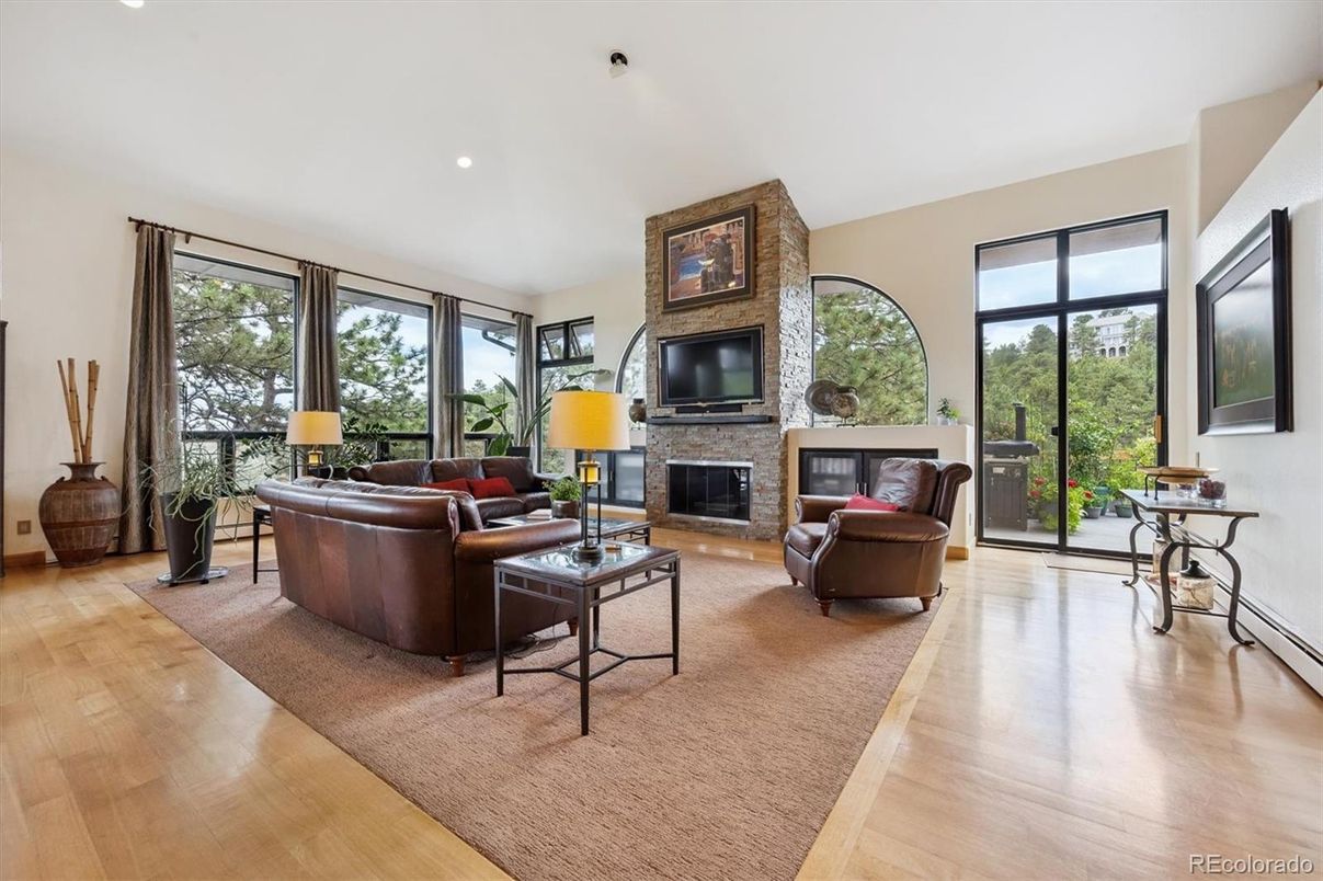 Fireplace, Interior, Living room, Recessed Lighting, Stone Walls, Wood Texture Flooring