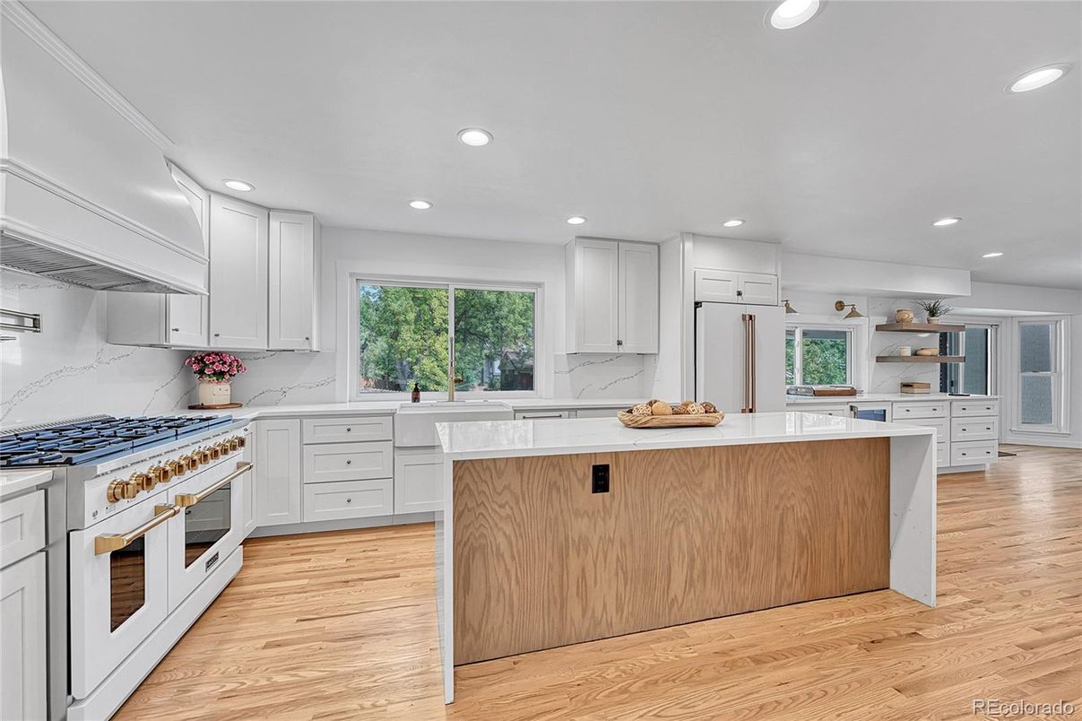 Interior, Kitchen, Marble Walls, Recessed Lighting, Stainless Steel Appliances, Wood Texture Flooring