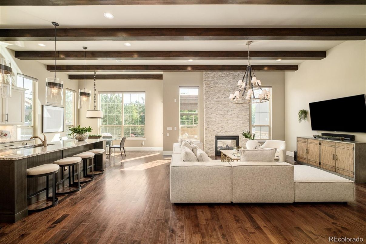 Dining room, Fireplace, Interior, Living room, Pendant Lights, Recessed Lighting, Stone Walls, Wooden Beams, Wood Texture Flooring