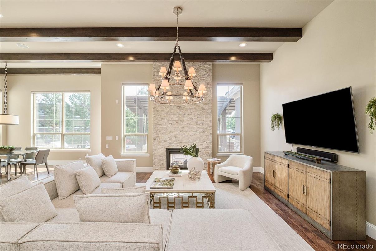 Chandelier, Dining room, Fireplace, Interior, Living room, Recessed Lighting, Stone Walls, Wooden Beams, Wood Texture Flooring