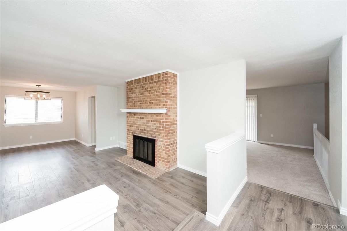 Empty room, Fireplace, Interior, Pendant Lights, Stone Walls, Wood Texture Flooring