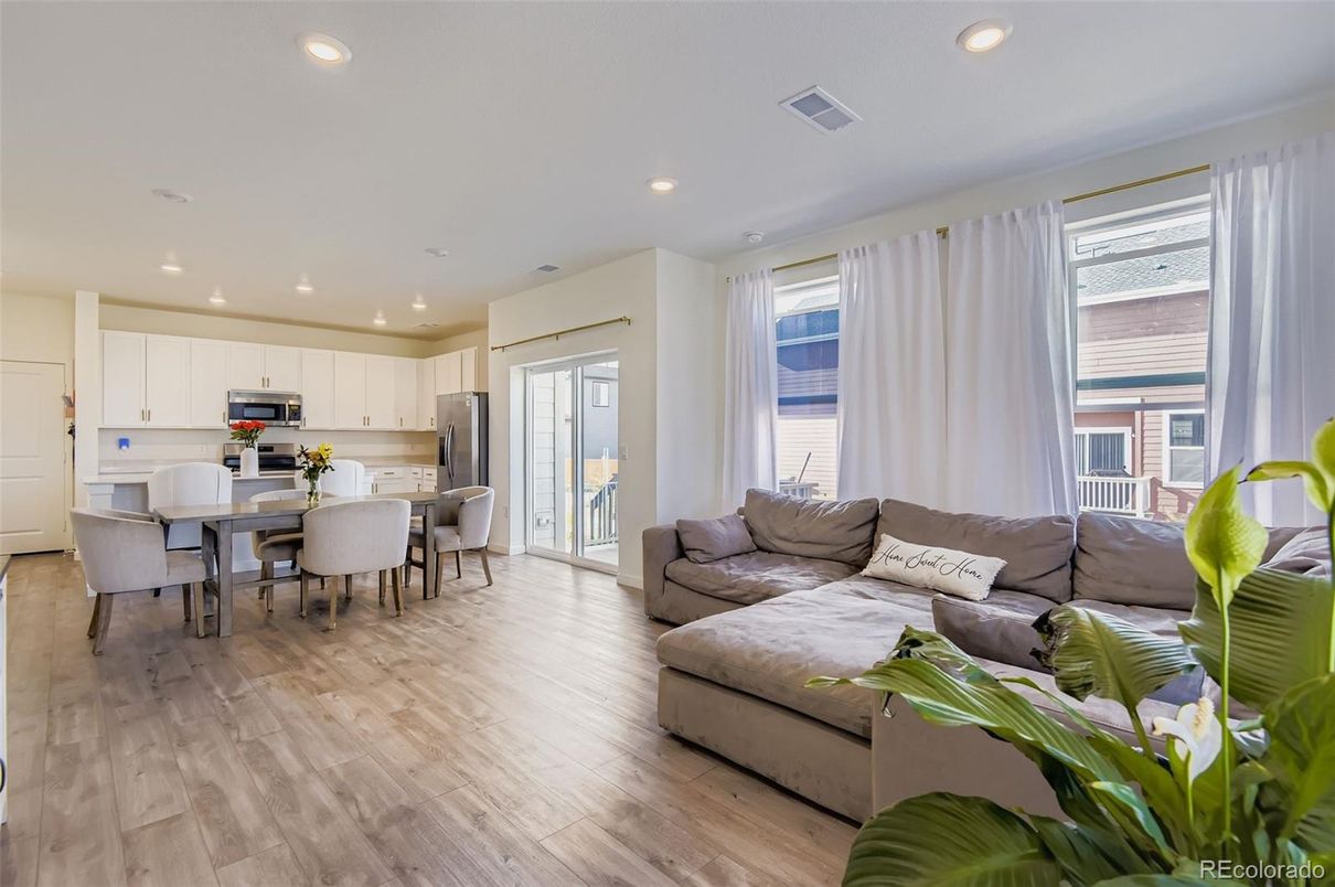 Dining room, Interior, Kitchen, Living room, Recessed Lighting, Stainless Steel Appliances, Wood Texture Flooring