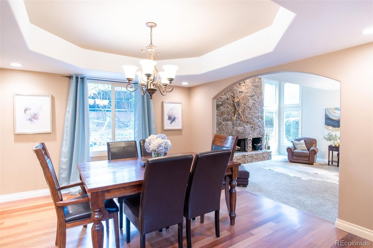 Chandelier, Dining room, Fireplace, Interior, Recessed Lighting, Stone Walls, Wood Texture Flooring