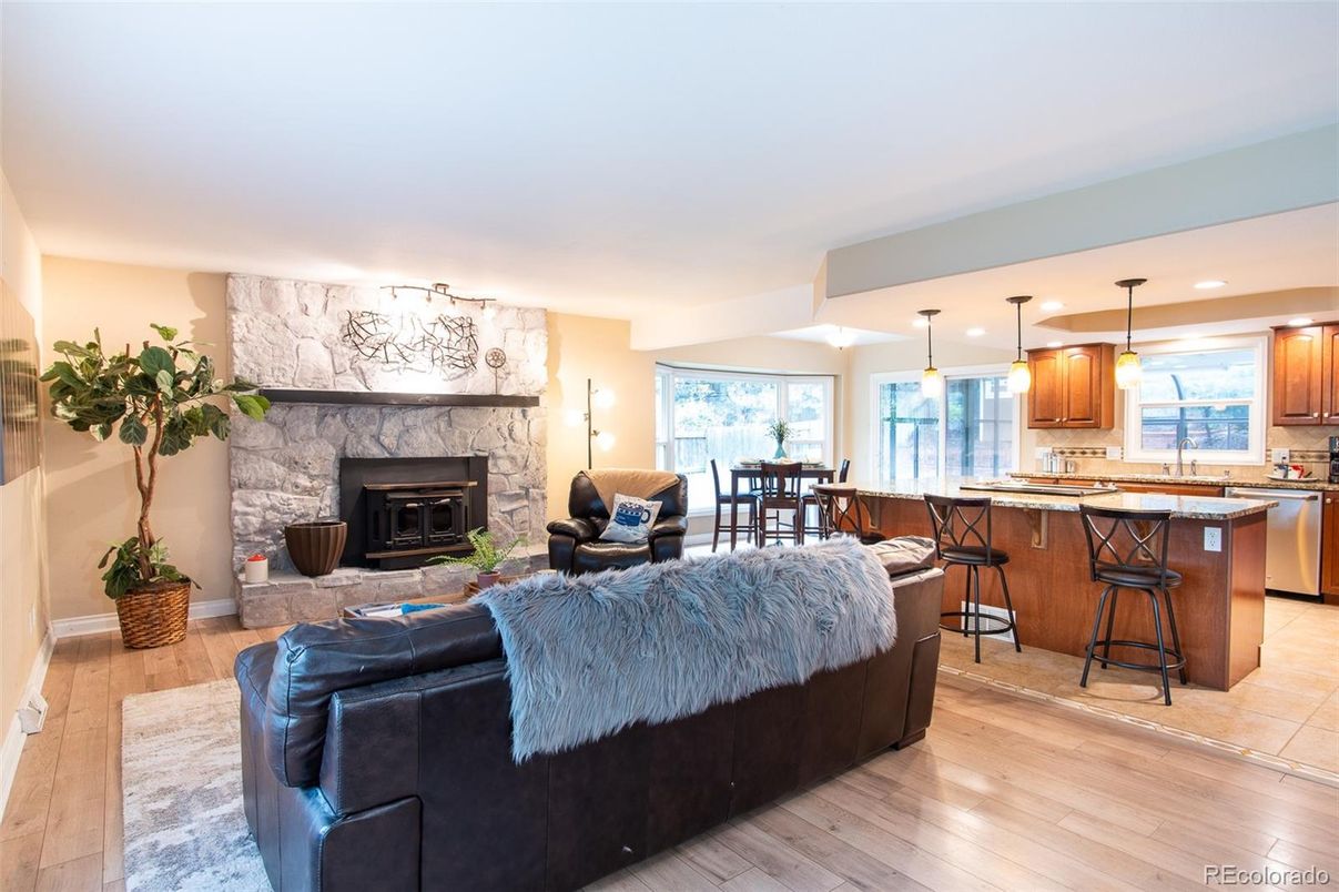 Dining room, Fireplace, Interior, Kitchen, Living room, Pendant Lights, Recessed Lighting, Stainless Steel Appliances, Wood Texture Flooring