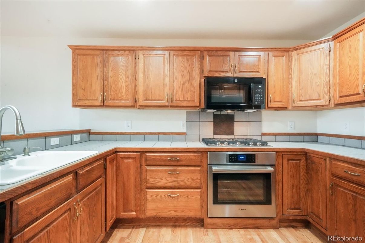 Interior, Kitchen, Tile Countertops, Wood Texture Flooring