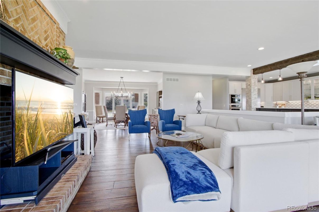 Chandelier, Dining room, Fireplace, Interior, Kitchen, Living room, Recessed Lighting, Stone Walls, Wood Texture Flooring