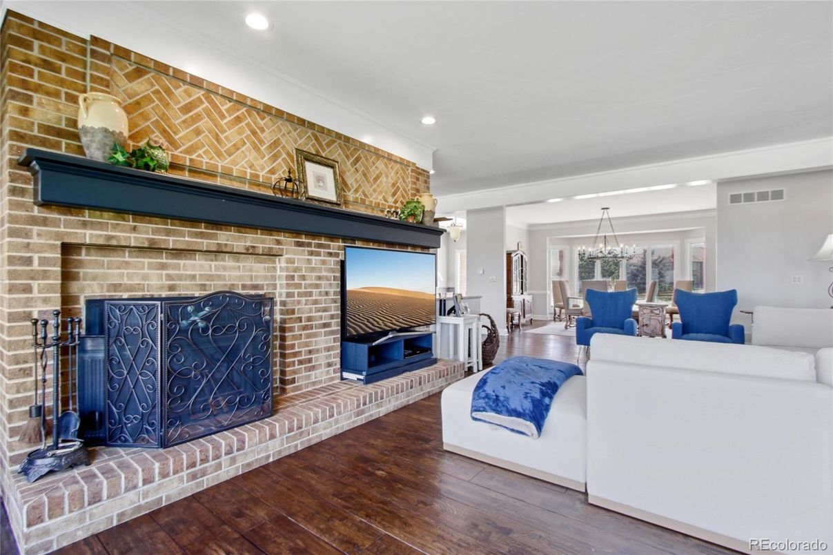 Dining room, Fireplace, Interior, Living room, Recessed Lighting, Stone Walls, Wood Texture Flooring