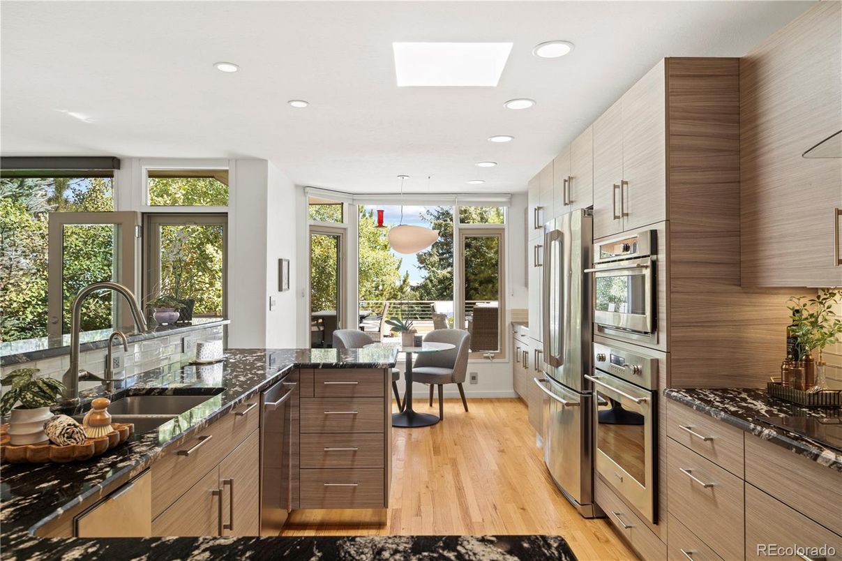 Dining room, Interior, Kitchen, Pendant Lights, Recessed Lighting, Stainless Steel Appliances, Wood Texture Flooring