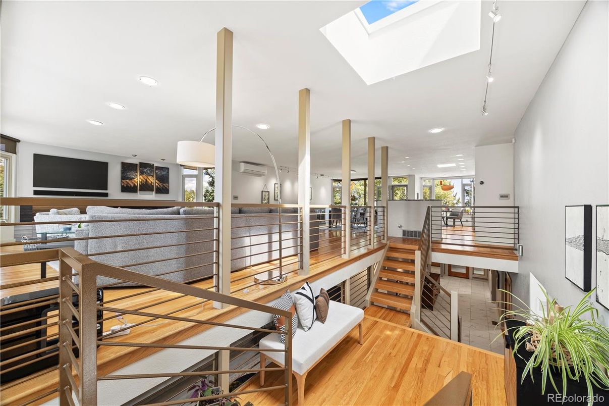 Dining room, Fireplace, Interior, Living room, Recessed Lighting, Wood Texture Flooring
