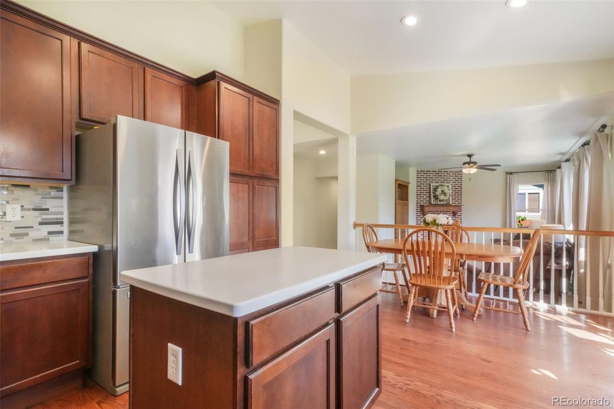 Dining room, Interior, Kitchen, Recessed Lighting, Stainless Steel Appliances, Stone Walls, Wood Texture Flooring