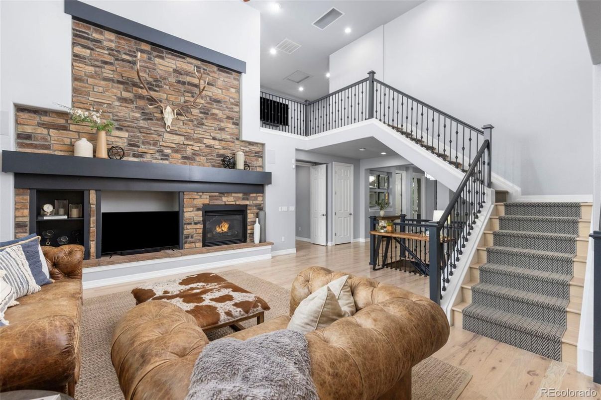 Fireplace, Interior, Living room, Recessed Lighting, Stone Walls, Wood Texture Flooring