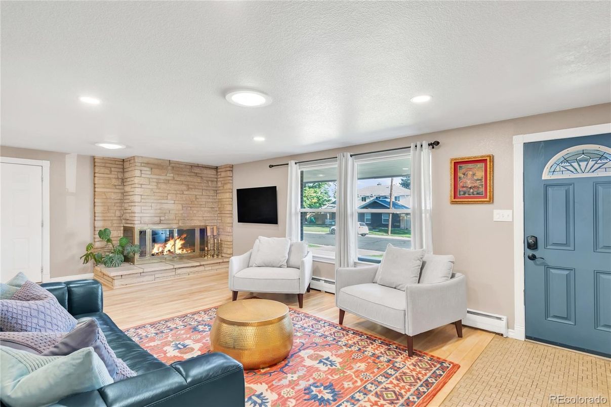 Fireplace, Interior, Living room, Recessed Lighting, Stone Walls, Wood Texture Flooring