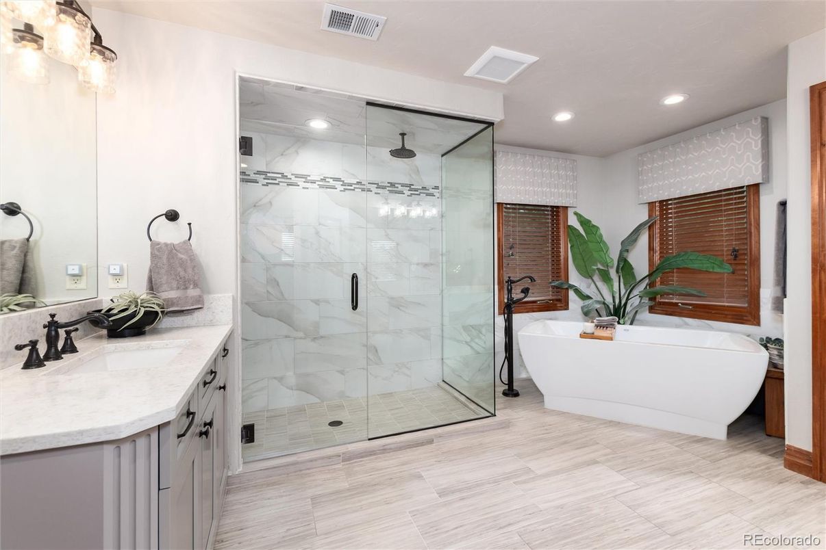 Bathroom, Dual Sink Vanities, Free Standing Baths, Glass Shower, Interior, Marble Walls, Recessed Lighting
