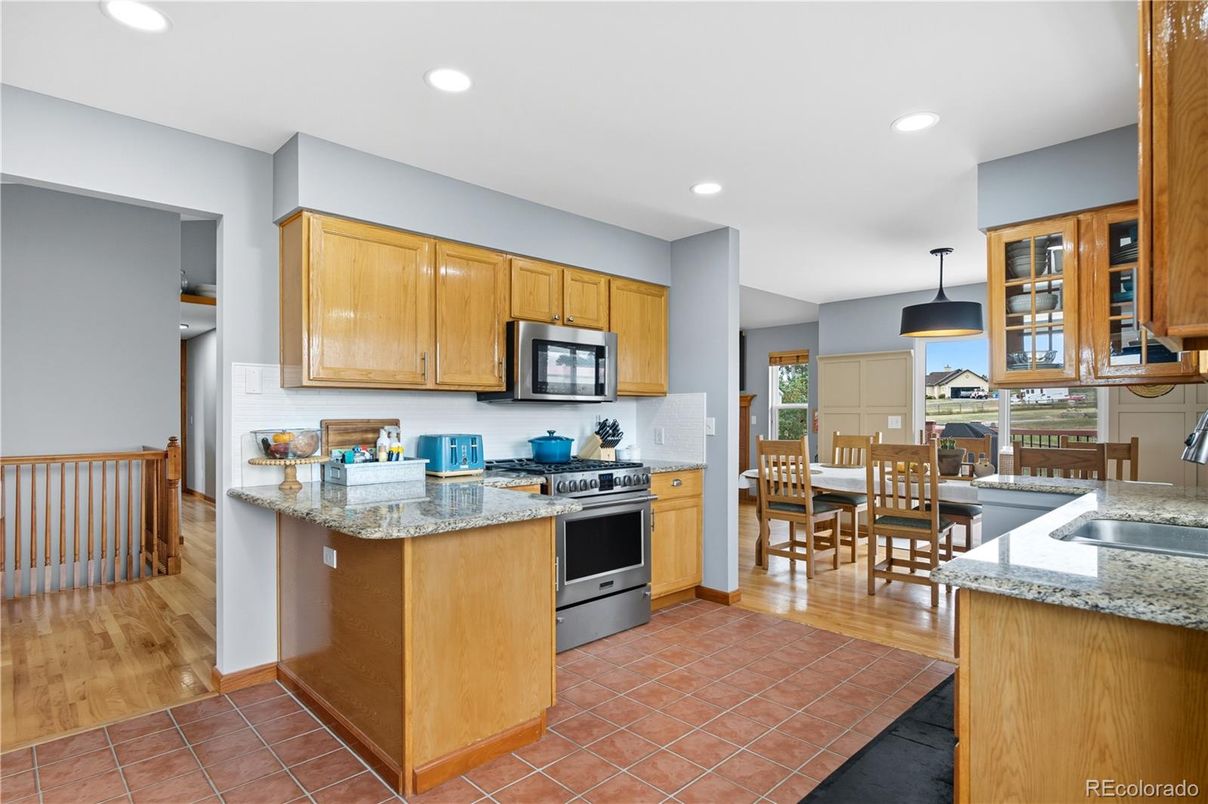 Dining room, Interior, Kitchen, Pendant Lights, Recessed Lighting, Stainless Steel Appliances, Wood Texture Flooring