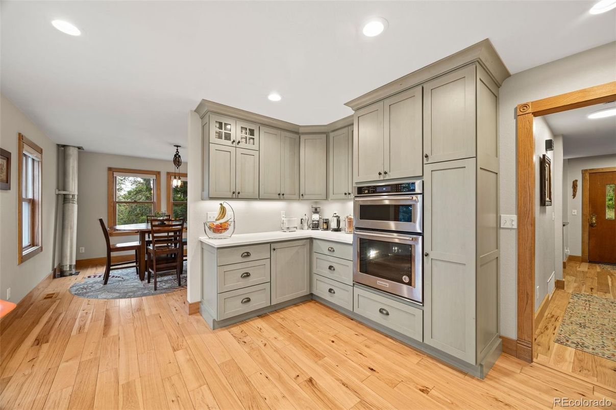 Dining room, Interior, Kitchen, Recessed Lighting, Stainless Steel Appliances, Wood Texture Flooring