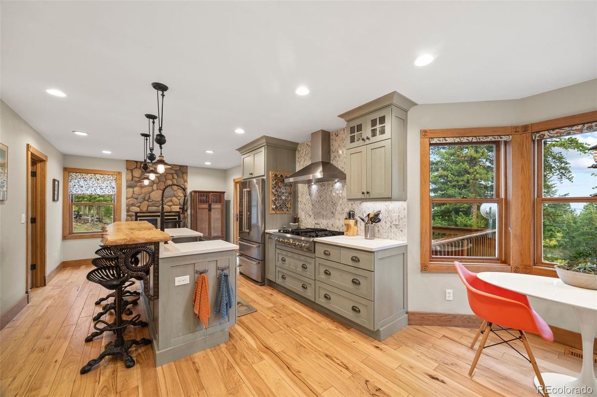 Interior, Kitchen, Pendant Lights, Recessed Lighting, Stainless Steel Appliances, Stone Walls, Wood Texture Flooring