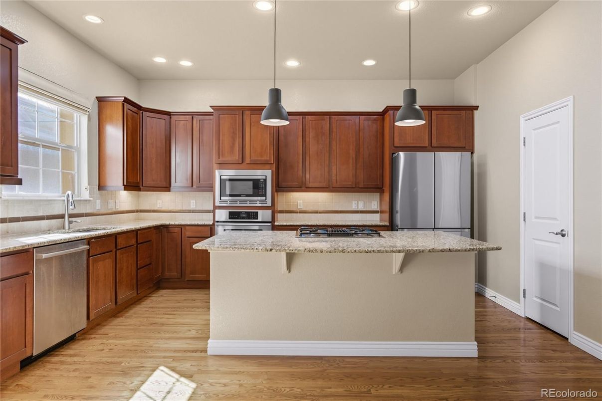 Interior, Kitchen, Pendant Lights, Recessed Lighting, Stainless Steel Appliances, Wood Texture Flooring