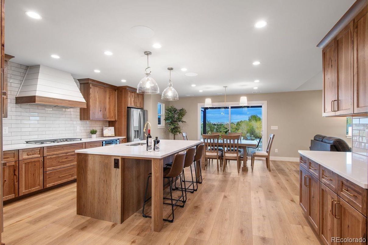 Dining room, Interior, Kitchen, Pendant Lights, Recessed Lighting, Stainless Steel Appliances, Wood Texture Flooring