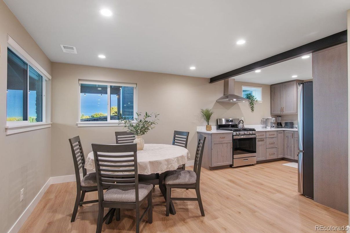 Dining room, Interior, Kitchen, Recessed Lighting, Stainless Steel Appliances, Wood Texture Flooring