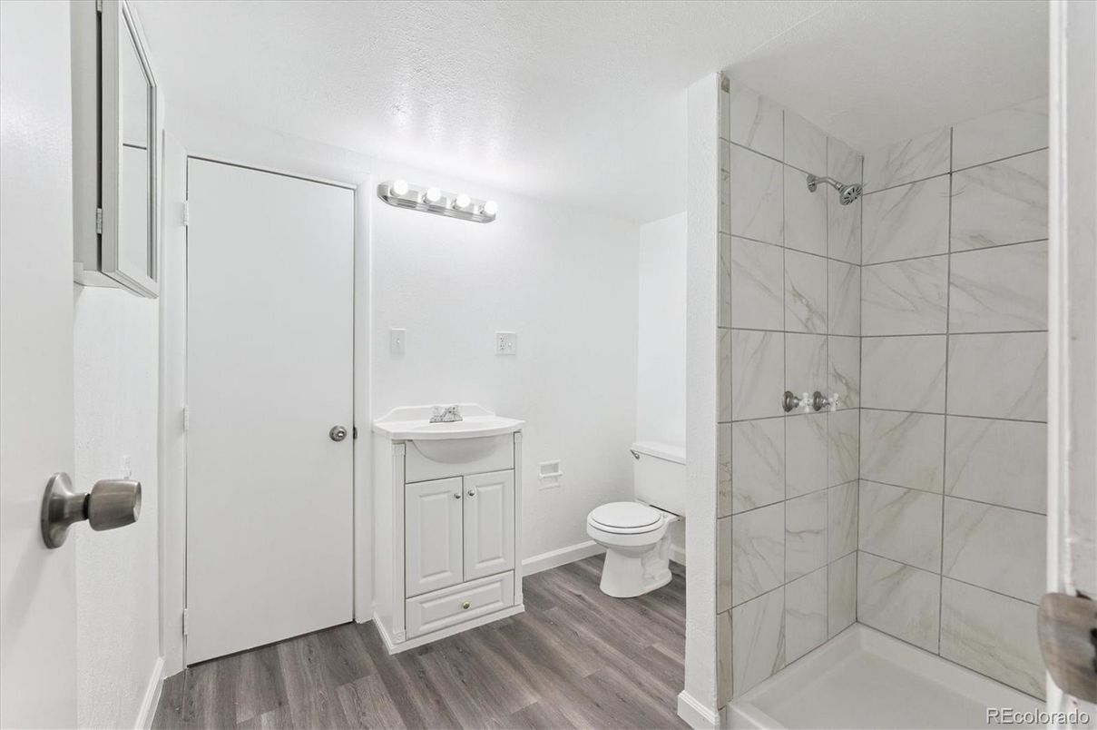 Bathroom, Glass Shower, Interior, Marble Walls, Wood Texture Flooring