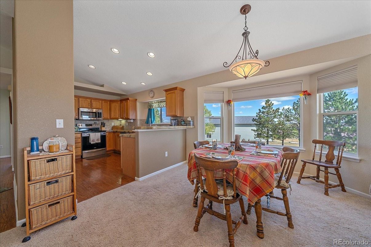 Chandelier, Dining room, Interior, Kitchen, Pendant Lights, Recessed Lighting, Stainless Steel Appliances, Water, Wood Texture Flooring