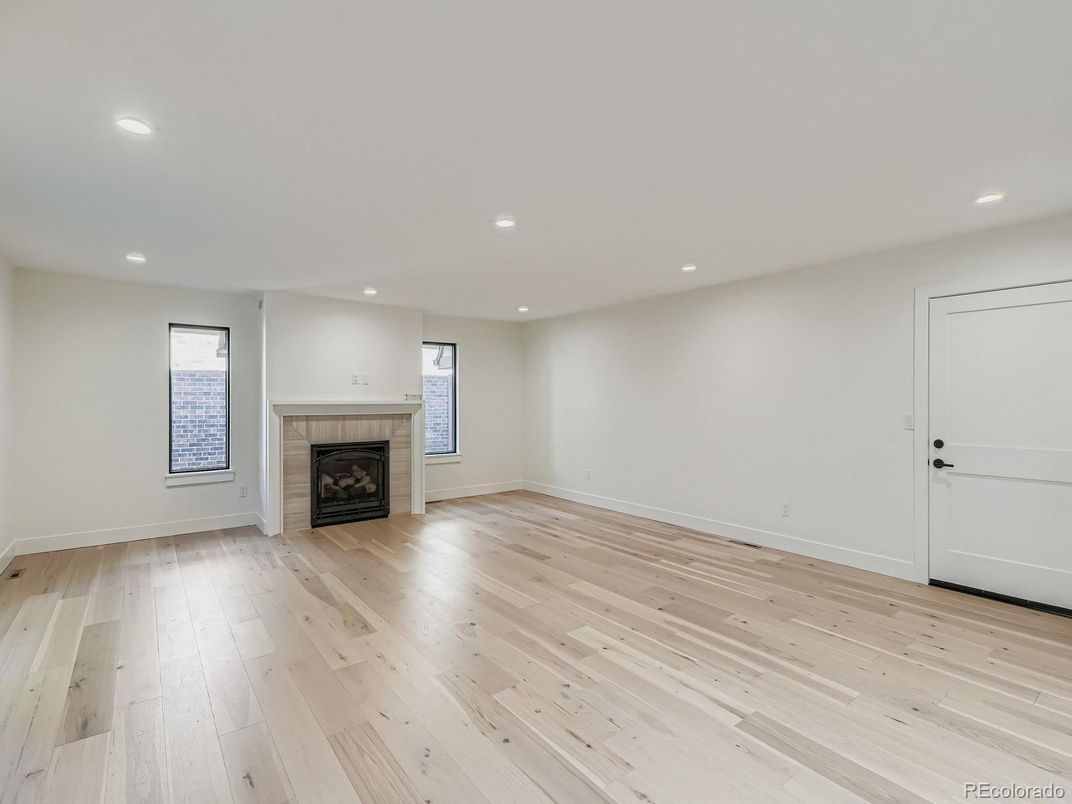 Empty room, Fireplace, Interior, Recessed Lighting, Wood Texture Flooring