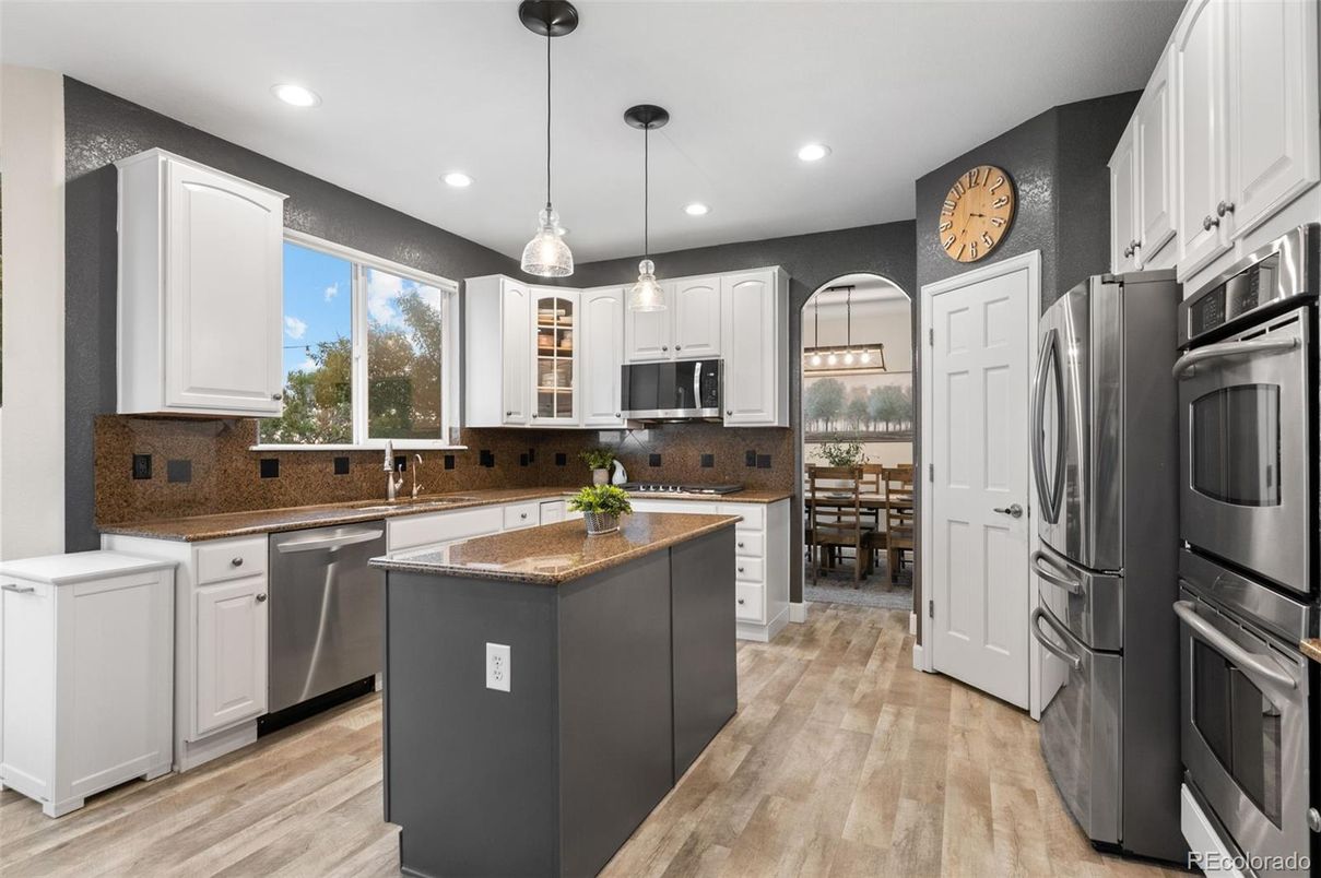 Dining room, Interior, Kitchen, Pendant Lights, Recessed Lighting, Stainless Steel Appliances, Wood Texture Flooring