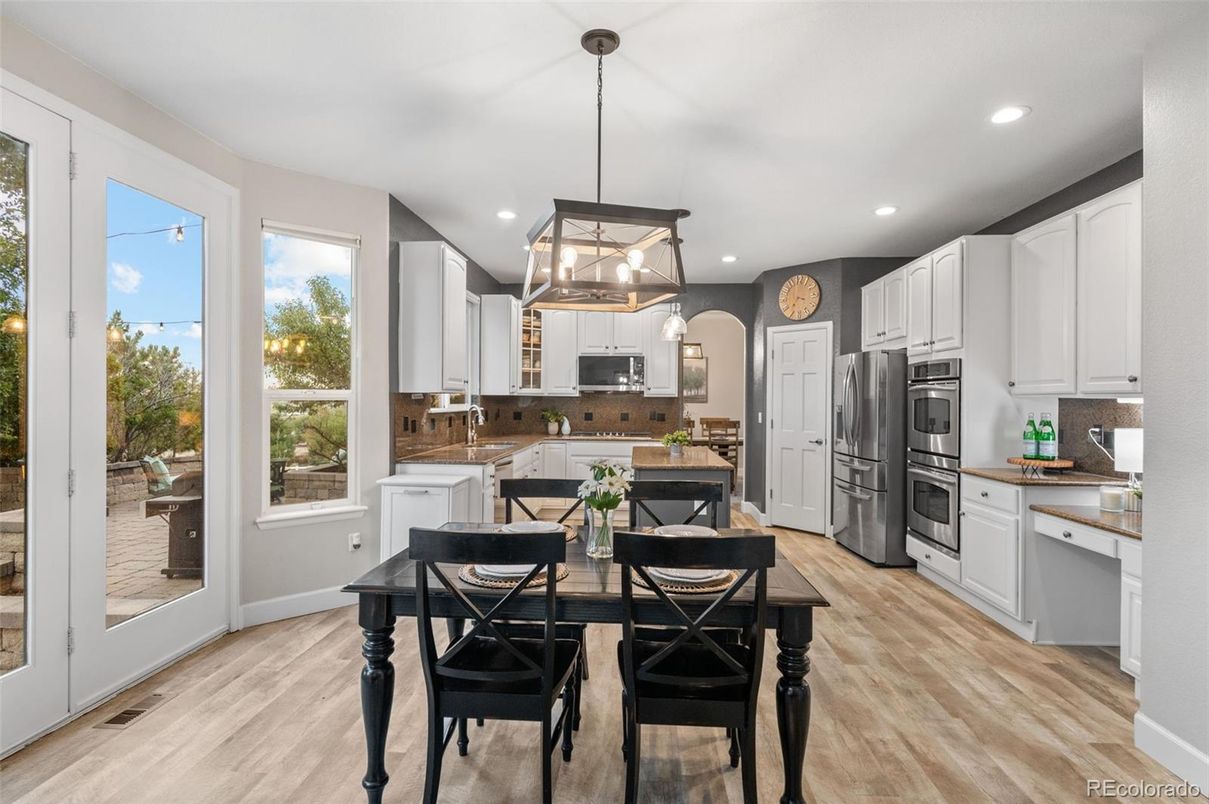 Dining room, Interior, Kitchen, Pendant Lights, Recessed Lighting, Stainless Steel Appliances, Wood Texture Flooring