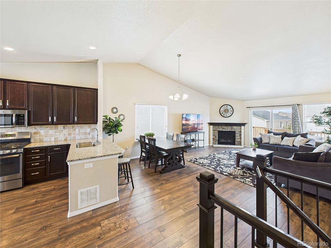 Dining room, Fireplace, Interior, Kitchen, Living room, Pendant Lights, Recessed Lighting, Stainless Steel Appliances, Wood Texture Flooring