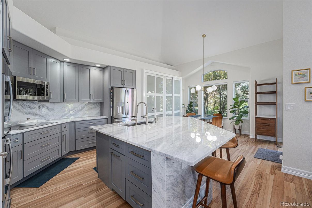 Interior, Kitchen, Marble Walls, Pendant Lights, Recessed Lighting, Stainless Steel Appliances, Wood Texture Flooring