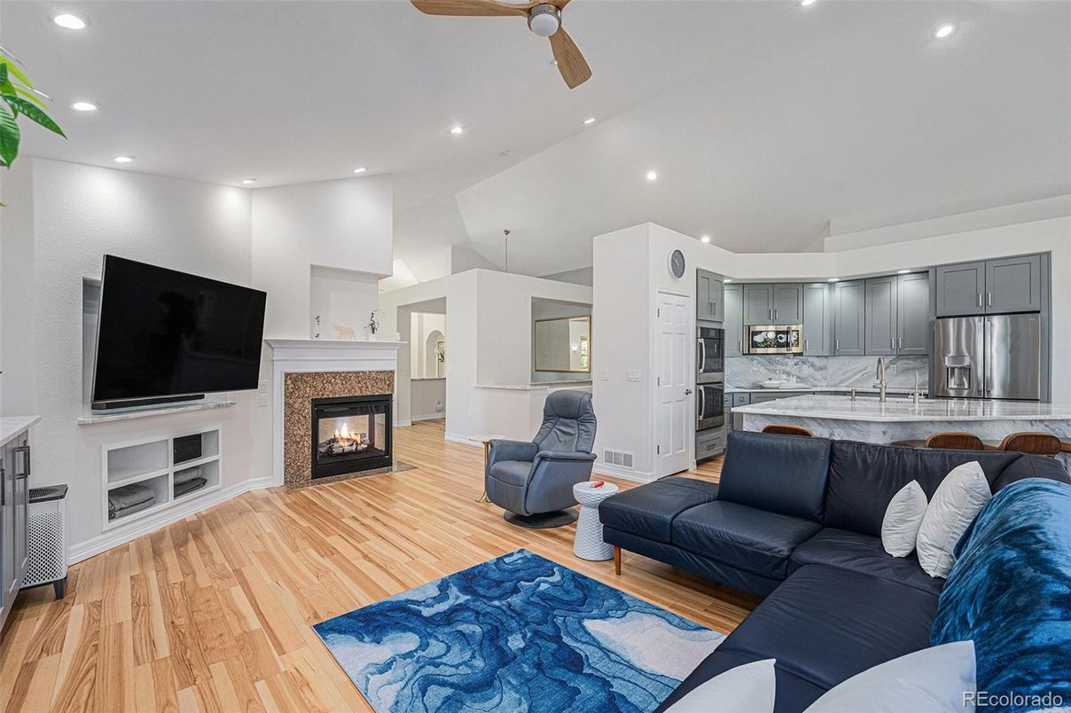 Fireplace, Interior, Kitchen, Living room, Recessed Lighting, Stainless Steel Appliances, Wood Texture Flooring